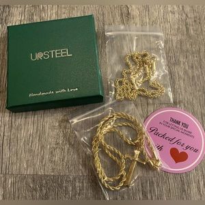 Brand new set of 2 layering gold tone cross necklace and matching chain.